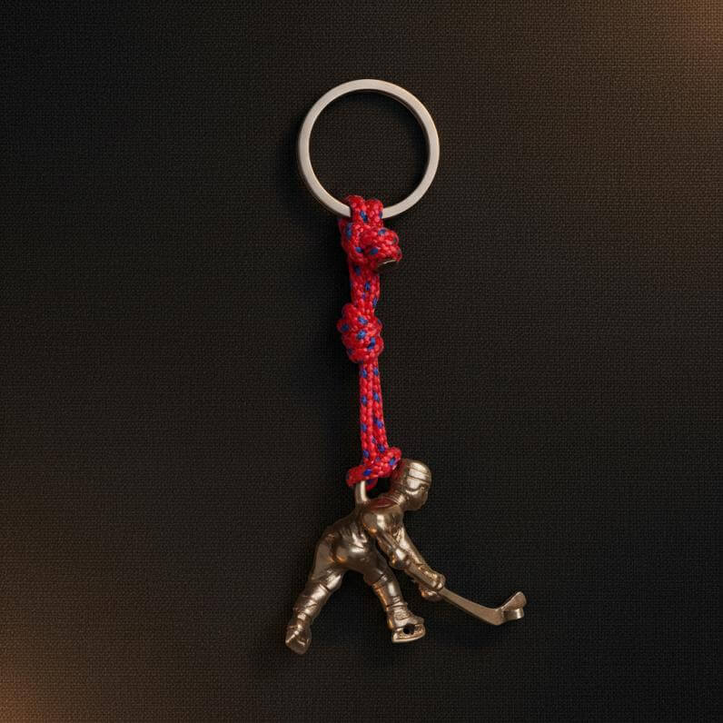 Llavero metálico importado con figura de bronce con el diseño de jugador de hockey